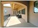 Spacious covered balcony featuring outdoor seating and great natural light through large windows at 3804 E Camelback Rd, Phoenix, AZ 85018
