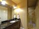 Well-lit bathroom boasts granite countertops and a tiled walk-in shower at 3804 E Camelback Rd, Phoenix, AZ 85018