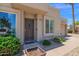 Close-up of the front entrance, featuring a charming door and decorative landscaping, plus two-car garage at 3919 E Larkspur Dr, Phoenix, AZ 85032