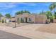 Attractive home featuring a well-maintained desert landscape and a convenient attached two-car garage at 3919 E Larkspur Dr, Phoenix, AZ 85032