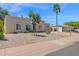Inviting home with desert landscaping and a 'coming soon' sign, framed by palm trees and blue sky at 3919 E Larkspur Dr, Phoenix, AZ 85032