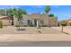 Charming home with low-maintenance desert landscaping, a barrel cactus, and a two-car garage at 3919 E Larkspur Dr, Phoenix, AZ 85032