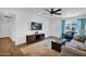Cozy living room with natural light, features a ceiling fan and comfortable seating area for Gathering at 3919 E Larkspur Dr, Phoenix, AZ 85032