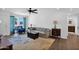 Open concept living room flows into kitchen, featuring modern flooring and comfortable furnishings at 3919 E Larkspur Dr, Phoenix, AZ 85032