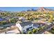 An aerial view showcases a white home with a well-maintained backyard, pergola, and a pool at 4131 E Roma Ave, Phoenix, AZ 85018
