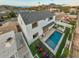 Aerial view of backyard with luxurious pool, modern patio and outdoor kitchen at 4131 E Roma Ave, Phoenix, AZ 85018