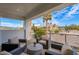 Inviting balcony provides comfortable seating and views of palm trees and the valley beyond at 4131 E Roma Ave, Phoenix, AZ 85018