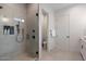 Contemporary bathroom boasts tiled shower with black fixtures and a clear glass door at 4131 E Roma Ave, Phoenix, AZ 85018