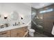 Modern bathroom featuring elegant vanity, sleek fixtures, and tiled walk-in shower at 4131 E Roma Ave, Phoenix, AZ 85018