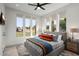 Bright bedroom featuring a large window and a view of the backyard at 4131 E Roma Ave, Phoenix, AZ 85018