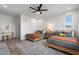 Bedroom with two beds, ceiling fan, walk-in closet, and decoratively styled vanity at 4131 E Roma Ave, Phoenix, AZ 85018