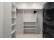 Well-organized closet features built-in shelving and modern washer and dryer units at 4131 E Roma Ave, Phoenix, AZ 85018