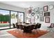 Spacious dining room with modern decor, a large table, and views of the pool area at 4131 E Roma Ave, Phoenix, AZ 85018