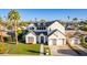 Stunning two-story home with a manicured lawn, three-car garage and a welcoming walkway at 4131 E Roma Ave, Phoenix, AZ 85018