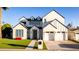 Charming two-story home featuring a three-car garage and well-manicured front yard at 4131 E Roma Ave, Phoenix, AZ 85018