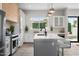 Spacious kitchen features stainless steel appliances, an island with seating, and ample natural light at 4131 E Roma Ave, Phoenix, AZ 85018