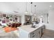 Open-concept kitchen with a large island, white countertops, and modern appliances at 4131 E Roma Ave, Phoenix, AZ 85018