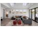 Open-concept living area boasts modern finishes, plenty of natural light, and seamless indoor/outdoor flow at 4131 E Roma Ave, Phoenix, AZ 85018
