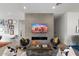 Modern living room featuring a fireplace, comfortable seating, and stylish decor for a cozy and inviting space at 4131 E Roma Ave, Phoenix, AZ 85018