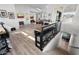 Bright, open-concept living area with staircase, luxury flooring, and neutral decor at 4131 E Roma Ave, Phoenix, AZ 85018