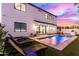 Backyard pool with lounge chairs and access to a covered kitchen, perfect for outdoor entertaining at 4131 E Roma Ave, Phoenix, AZ 85018