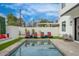 Backyard oasis with a refreshing pool, cozy lounge chairs, and lush greenery at 4131 E Roma Ave, Phoenix, AZ 85018