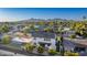 Aerial view highlighting the home's backyard with a quaint patio and lush greenery at 4131 E Roma Ave, Phoenix, AZ 85018