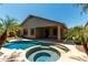 Inviting backyard with a private pool, spa, and covered patio, perfect for outdoor living at 418 W Balsam Dr, Chandler, AZ 85248