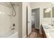 Bathroom featuring tub-shower combo, double sink vanity, and tile floor at 418 W Balsam Dr, Chandler, AZ 85248