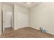 Bedroom featuring carpeted floor, closet, and door to another room at 418 W Balsam Dr, Chandler, AZ 85248