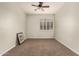 Cozy carpeted bedroom featuring a ceiling fan and window with shutter style blinds at 418 W Balsam Dr, Chandler, AZ 85248