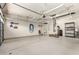 Spacious and clean garage with overhead storage racks and ample room for vehicles at 418 W Balsam Dr, Chandler, AZ 85248