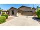 An attached two-car garage with a basketball hoop and low maintenance landscaping at 418 W Balsam Dr, Chandler, AZ 85248