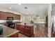 Updated kitchen featuring granite countertops, black appliances, and hardwood flooring at 418 W Balsam Dr, Chandler, AZ 85248