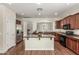 Modern kitchen with stainless steel appliances, granite countertops, and a large island at 418 W Balsam Dr, Chandler, AZ 85248