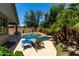 Relaxing poolside view with lounge chairs and a shimmering pool and spa combo at 418 W Balsam Dr, Chandler, AZ 85248