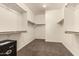 Spacious walk-in closet with carpeted floor and ample shelving for organization at 418 W Balsam Dr, Chandler, AZ 85248
