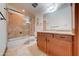 Bathroom featuring a walk-in shower, wood vanity, and tile floors at 424 E Lehi Rd # 2, Mesa, AZ 85203