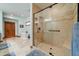 Bathroom featuring a soaking tub and a glass-enclosed shower at 424 E Lehi Rd # 2, Mesa, AZ 85203
