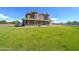 Expansive lawn and lush green yard highlight the charm of this two-story brick home at 424 E Lehi Rd # 2, Mesa, AZ 85203