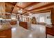 Spacious kitchen with stainless appliances, a central island and wood beam vaulted ceilings at 424 E Lehi Rd # 2, Mesa, AZ 85203