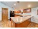 Charming kitchen featuring wooden cabinets, granite countertops, and stainless steel appliances at 424 E Lehi Rd # 2, Mesa, AZ 85203
