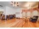 Inviting living room with hardwood floors, vintage furnishings, and a large window at 424 E Lehi Rd # 2, Mesa, AZ 85203