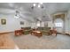 Spacious living room featuring two sofas, two windows, wood floors, and neutral walls at 424 E Lehi Rd # 2, Mesa, AZ 85203