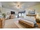 Large primary bedroom featuring wood floors, a sitting area, and bright natural lighting at 424 E Lehi Rd # 2, Mesa, AZ 85203
