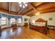 Primary bedroom suite boasts a vaulted beamed ceiling and large windows at 424 E Lehi Rd # 2, Mesa, AZ 85203