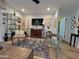 Comfortable living room featuring hardwood floors, a flat screen tv, and modern decor at 4554 E Paradise Village N Pkwy # 133, Phoenix, AZ 85032