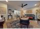 Inviting living room with hardwood floors, stylish furnishings, and a view into the dining area at 4554 E Paradise Village N Pkwy # 133, Phoenix, AZ 85032