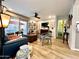 Spacious living area with wood floors, ceiling fan, sliding glass doors and stylish decor at 4554 E Paradise Village N Pkwy # 133, Phoenix, AZ 85032