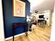 Stylish living room features hardwood floors, dark blue accent wall and elegant furniture at 4554 E Paradise Village N Pkwy # 133, Phoenix, AZ 85032